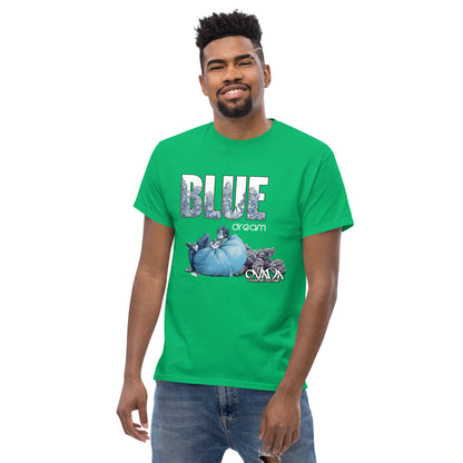 A man in a green cotton graphic t-shirt with the words Blue Dream. A monochromatic blue cartoon depiction of a stoner passed out in a bean back with marijuana buds behind him. Weed