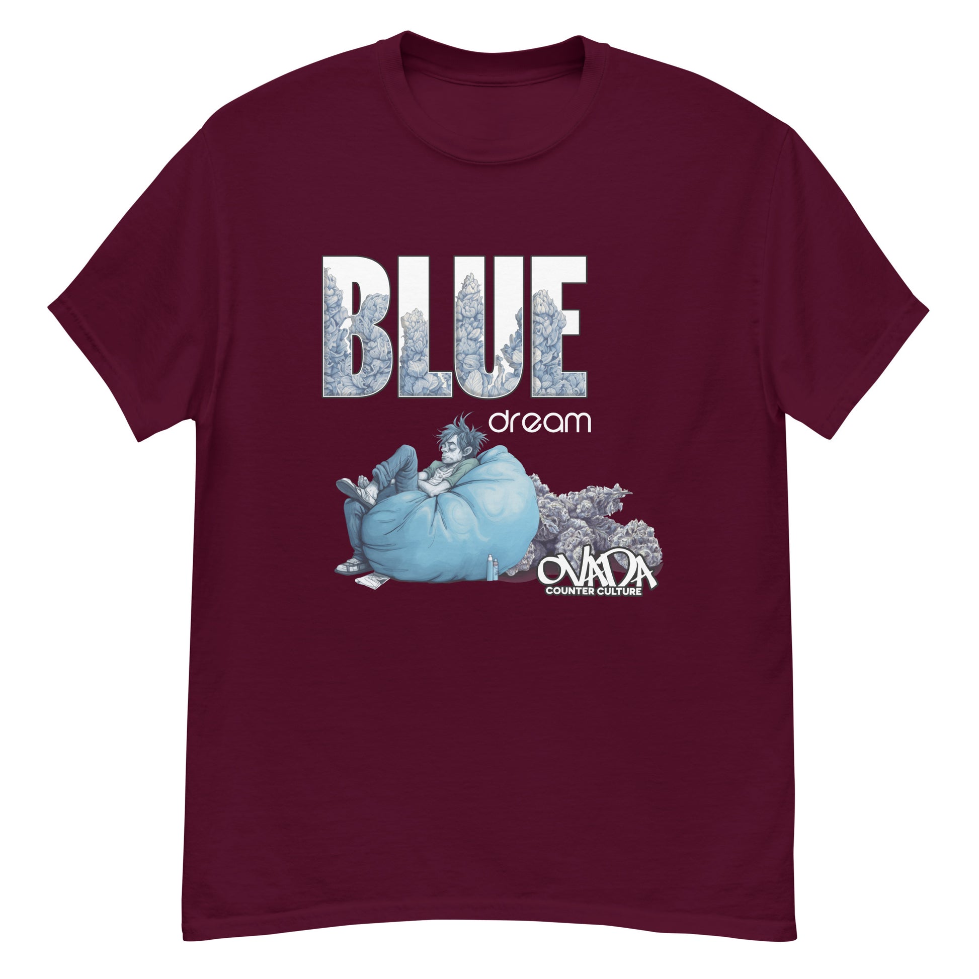 A maroon cotton graphic t-shirt with the words Blue Dream. A monochromatic blue cartoon depiction of a stoner passed out in a bean back with marijuana buds behind him.