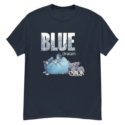 A navy blue cotton graphic t-shirt with the words Blue Dream. A monochromatic blue cartoon depiction of a stoner passed out in a bean back with marijuana buds behind him.